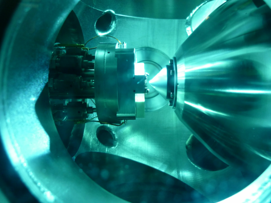 Sample in front of cone of differentially pumped lens system - enlarged view