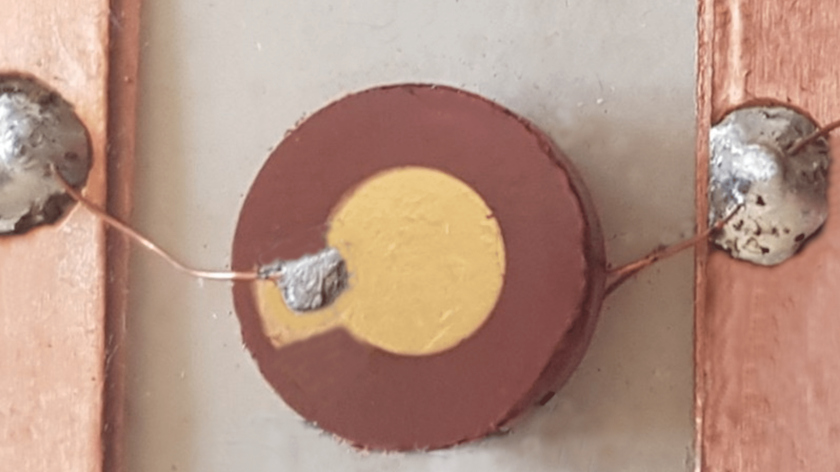 The polycrystalline powder was pressed into a dense pellet with a diameter of 10 mm.