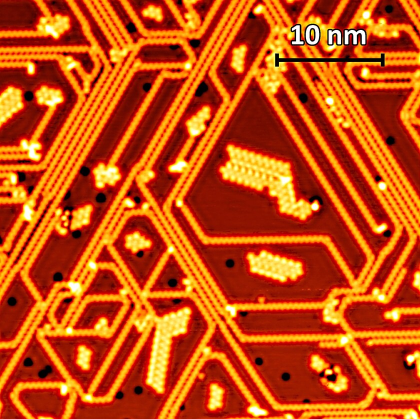 The image taken with the scanning tunnelling microscope shows the phosphorus atoms arranged in short chains on a silver substrate.