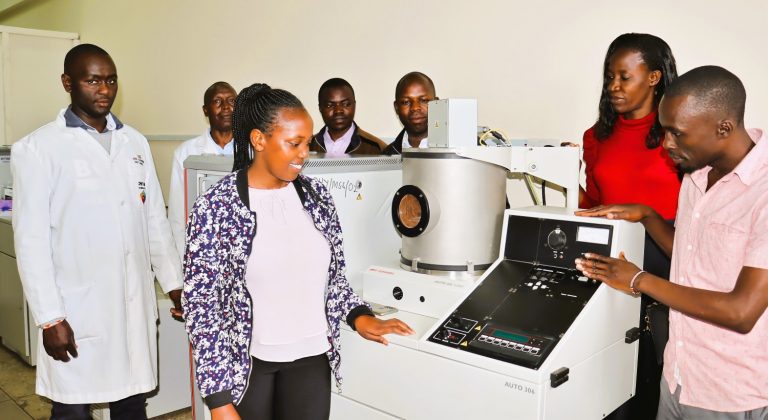 Tabitha Amollo (in red top) with her research group of students and technical staff.