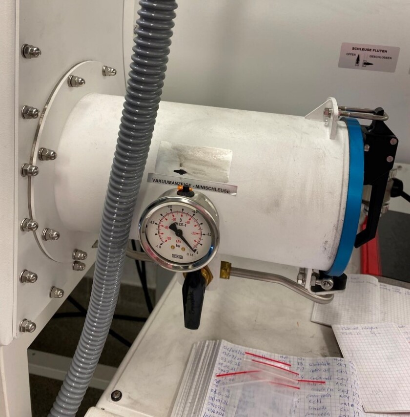 Before anything could enter the glovebox, it had to pass through a small airlock, a separate compartment that removes the air before the materials are transferred into the main chamber.