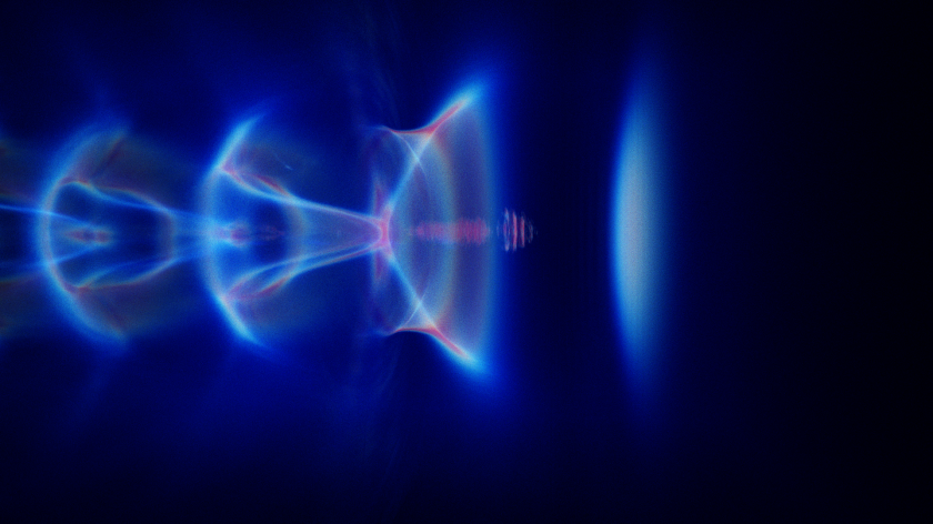 The laser wakefield acceleration (simulation): The laser pulse (not shown) is moving to the right and is so intense that it expels all the plasma electrons from its path and creates a bubble-like feature in the plasma, which contains positively charged ions and hence has strong electric fields that pull electrons into the bubble and accelerate them as they ride along with the laser pulse.