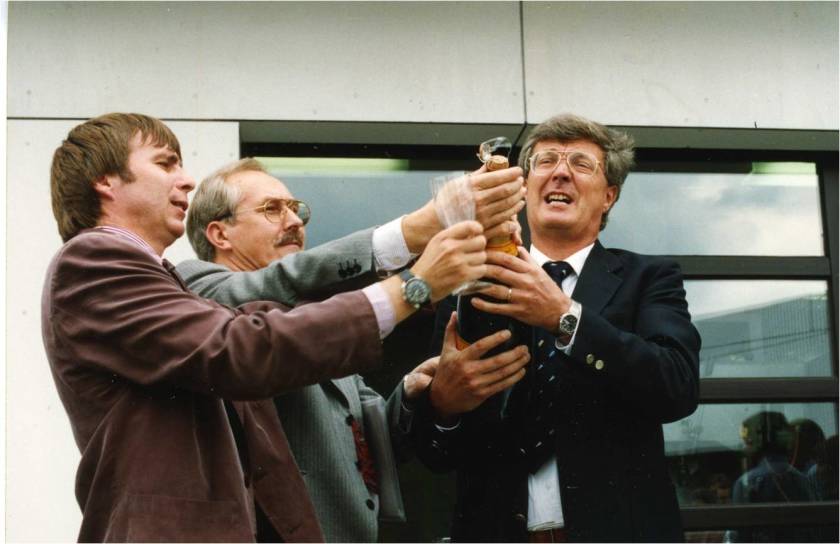Walter D&ouml;rhage (left), Wolfgang Gudat (centre) and Eberhard Jaeschke (right) toast the decision to build BESSY II on the terrace of BESSY in Wilmersdorf.