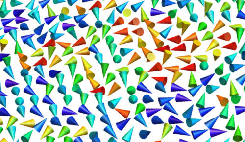 The cones represents the magnetization of the nanoparticles. In the absence of electric field (strain-free state) the size and separation between particles leads to a random orientation of their magnetization, known as superparamagnetism