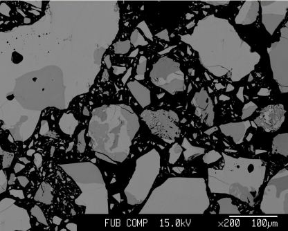 Backscattered electron micrograph of kesterite powder. Grey grains are attributed to CZTSe. Black background is the epoxy matrix. 